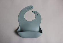 Load image into Gallery viewer, Silicone Baby Bib with pouch, BPA free, non-toxic, earthy natural colours and tones, ocean blue
